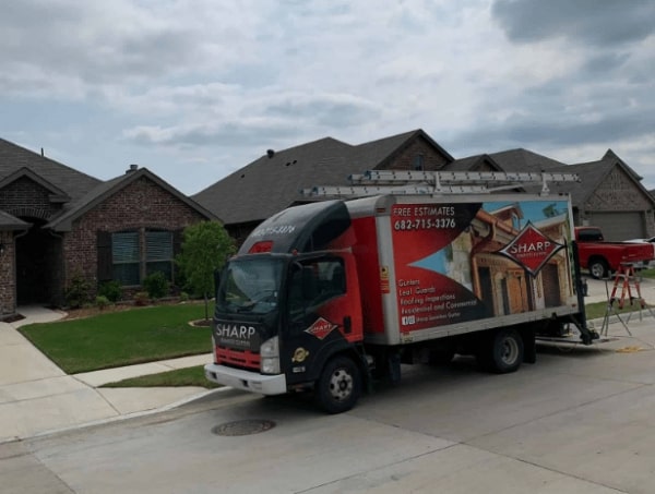 Parked Gutter Repairs Fort Worth, TX. Truck from seamless gutter